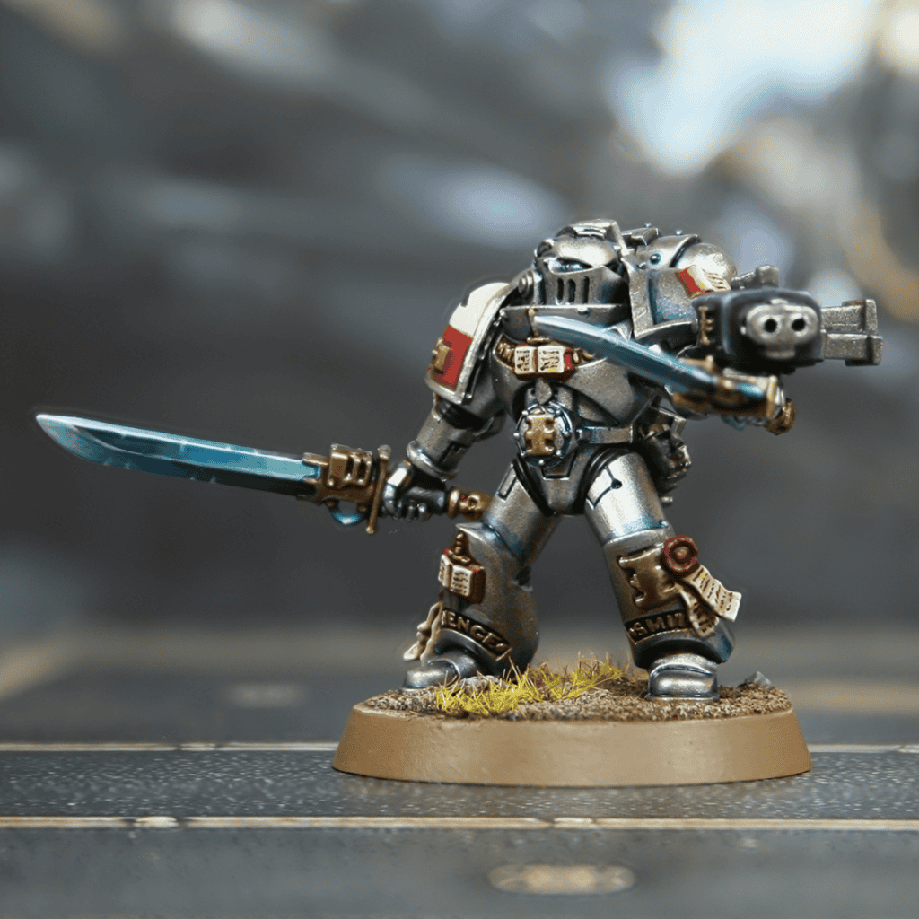 Detailed Grey Knight Space Marine figure for Warhammer painting and modeling guides.